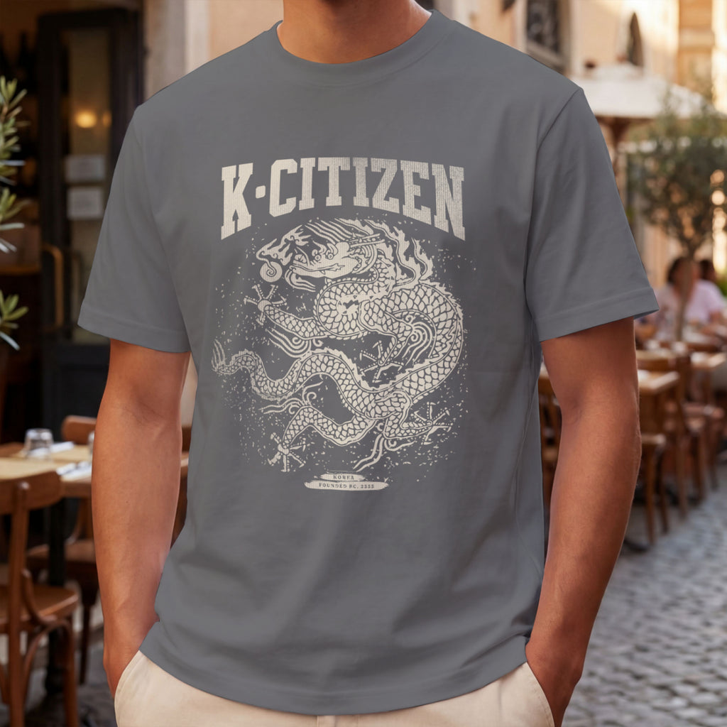 Person wearing a gray t-shirt with a dragon graphic and 'K-Citizen' text in an outdoor setting.