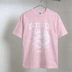 Pink t-shirt with 'K-Citizen' logo on a hanger against a gray background