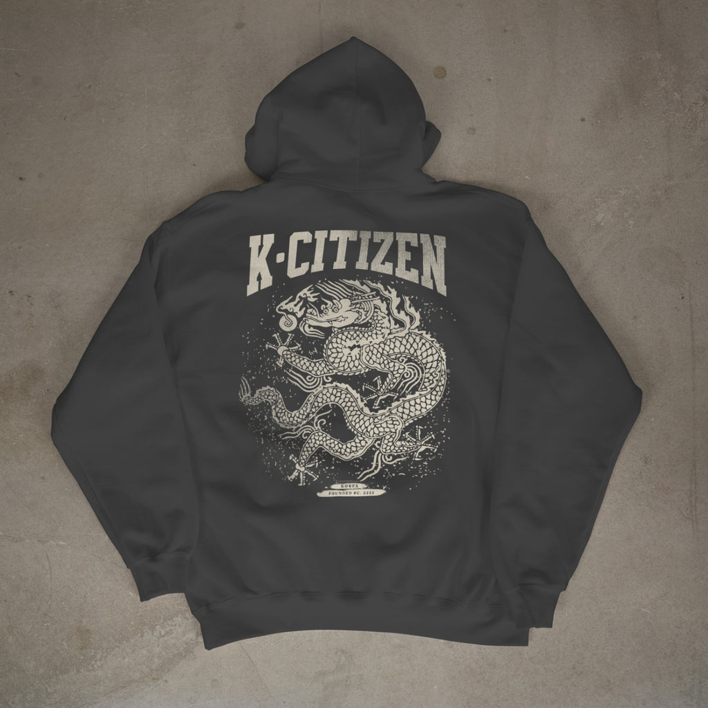Dark gray hoodie with 'K-Citizen' logo and dragon design on a concrete floor.