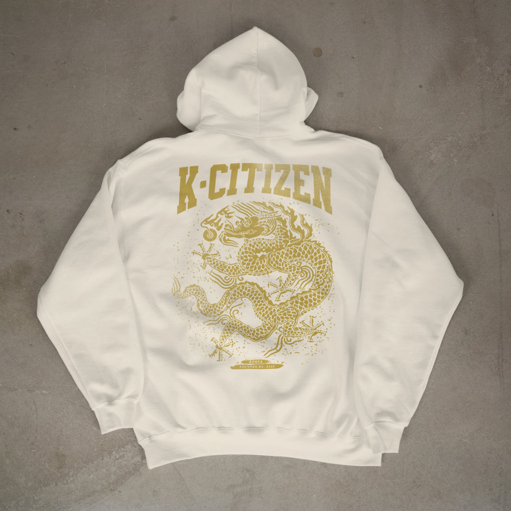 White hoodie with gold 'K-Citizen' logo and dragon design on a gray background