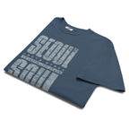 close-up of Blue t-shirt featuring a distressed white "SEOUL SOUL" graphic with South Korea geographic coordinates